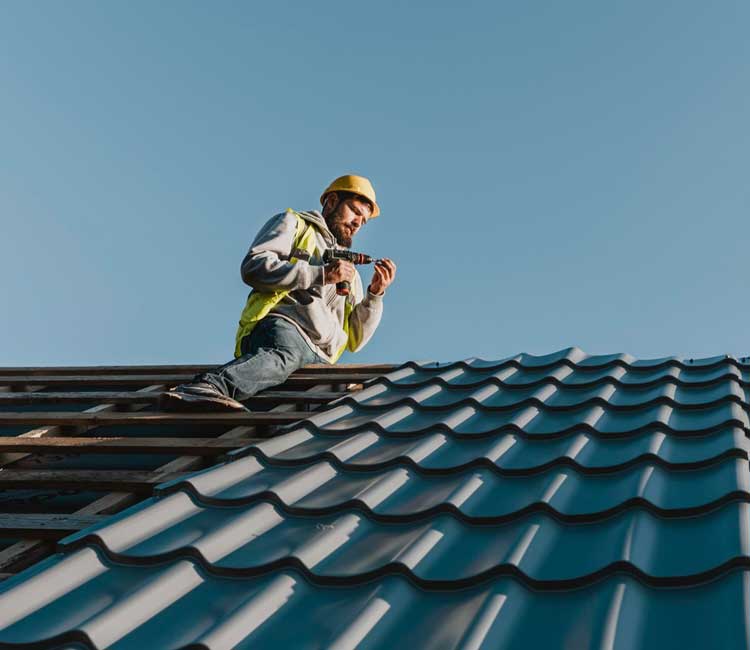 Greenleaf Building Group technician works on a roof installation in the Charlotte metro.