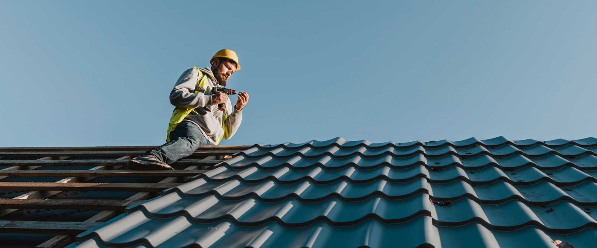 Greenleaf Building Group technician works on a roof installation in the Charlotte metro.